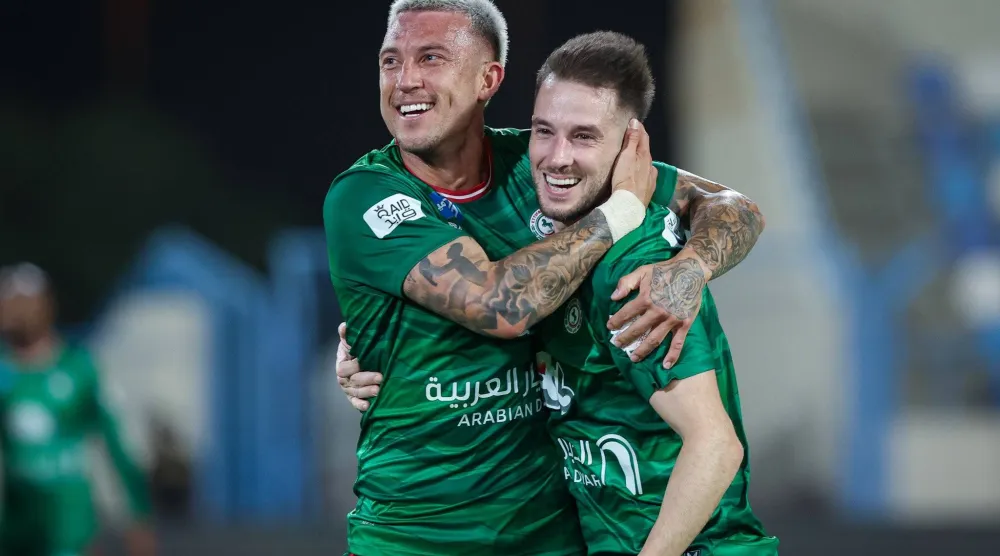 ميدران لاعب الاتفاق محتفلاً بهدفه في الأخدود (موقع النادي)