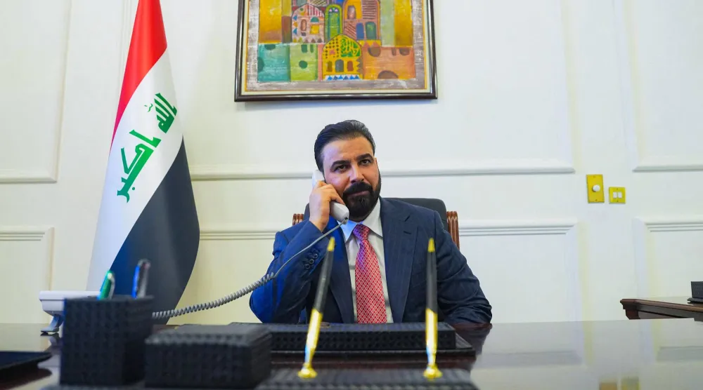 This handout photograph taken and released by the Iraqi Prime Minister's Press Office on April 28, 2026 shows new prime minister-designate Ali al-Zaidi talking on the phone at his office in Baghdad. (Iraqi Prime Minister’s Press Office /AFP)