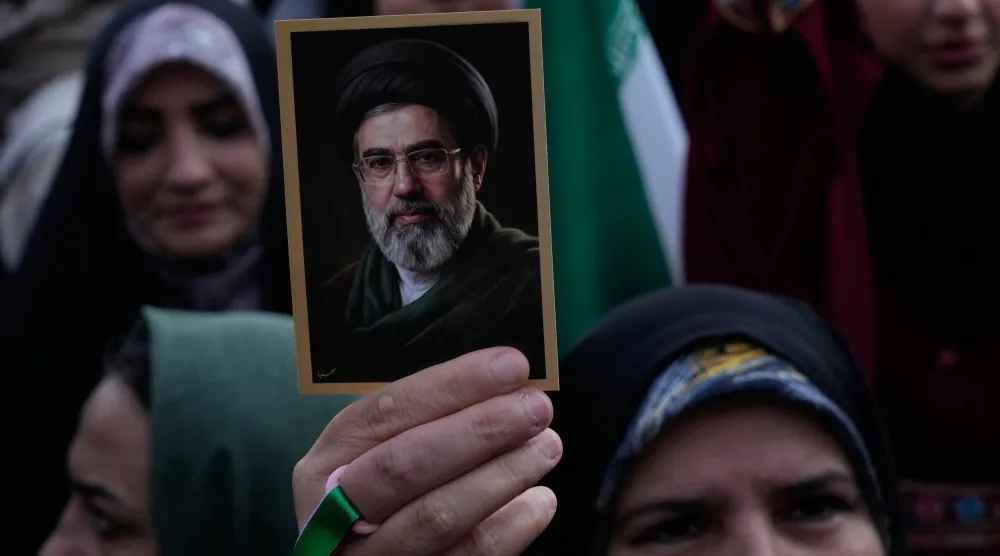 A woman holds up a picture of the Iranian Supreme Leader Mojtaba Khamenei during a state-organized rally in Tehran, Iran, Wednesday, April 29, 2026. (AP) 