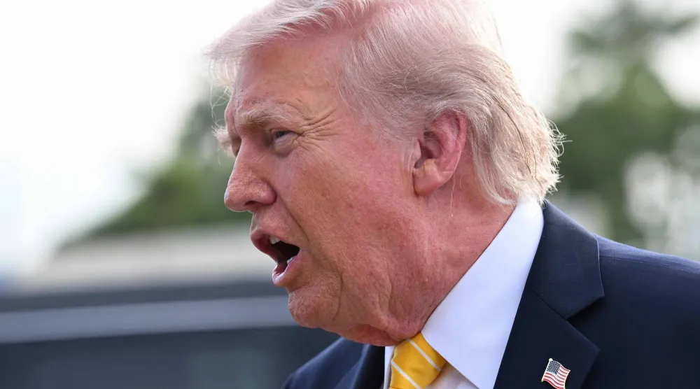 PALM BEACH, FLORIDA - MAY 2: US President Donald Trump speaks to journalists before boarding Air Force One at Palm Beach International Airport on May 2, 2026 in Palm Beach, Florida. Trump is spending the weekend at his Mar-A-Lago resort. Roberto Schmidt/Getty Images/AFP 