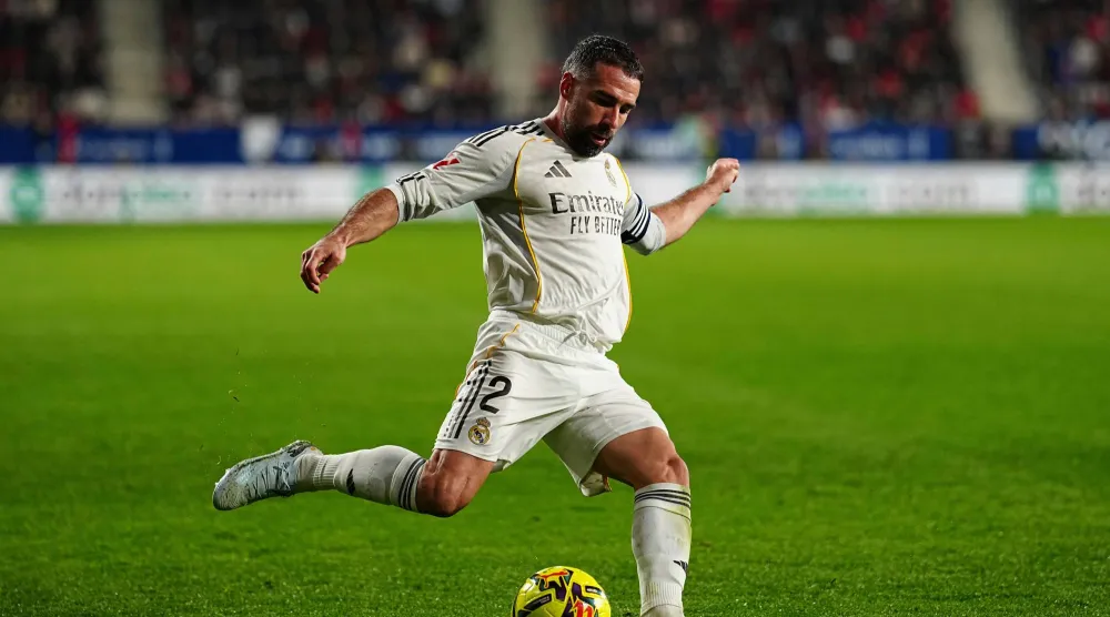 FILE - Real Madrid's Dani Carvajal plays the ball during a Spanish La Liga soccer match between Osasuna and Real Madrid in Pamplona, Spain, Feb. 21, 2026. (AP Photo/Miguel Oses, File)