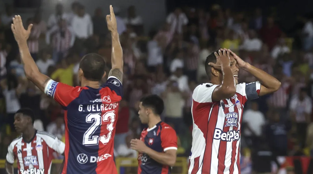 Carlos Bacca (R) of Junior reacts during a Copa Libertadores group stage soccer match between Junior and Cerro Porteno at Romelio Martinez Stadium in Cartagena, Colombia, 07 May 2026.  EPA/Ricardo Maldonado Rozo