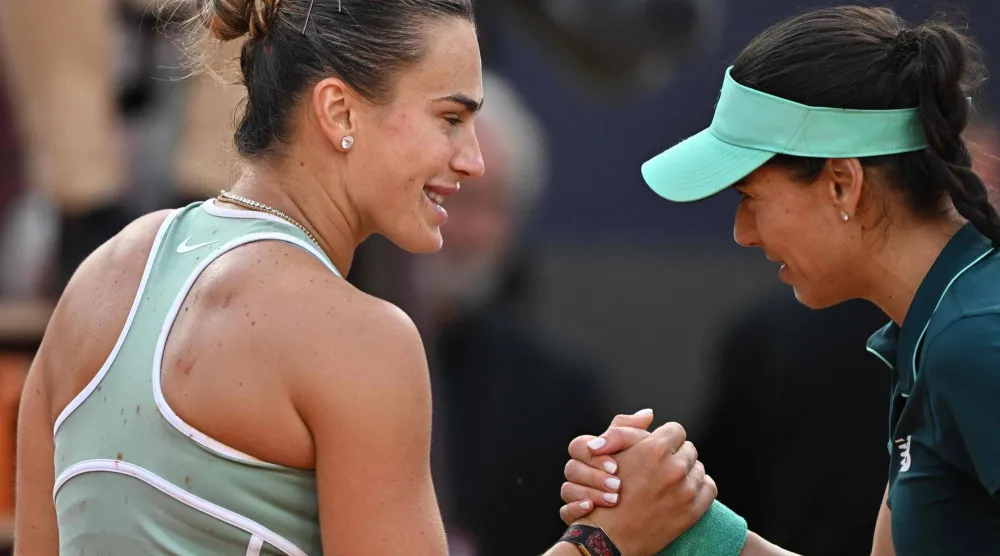 Belarus' Aryna Sabalenka congratulates Romania's Sorana Cirstea after being defeated during the WTA Rome Open tennis tournament at Foro Italico in Rome on May 9, 2026. (Photo by Tiziana FABI / AFP)