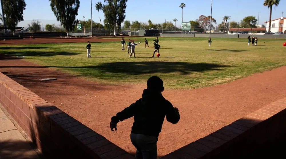 Students play ball during recess at the St. Agnes Elementary School in Phoenix, Ariz., on March 3, 2020. (AP) 
