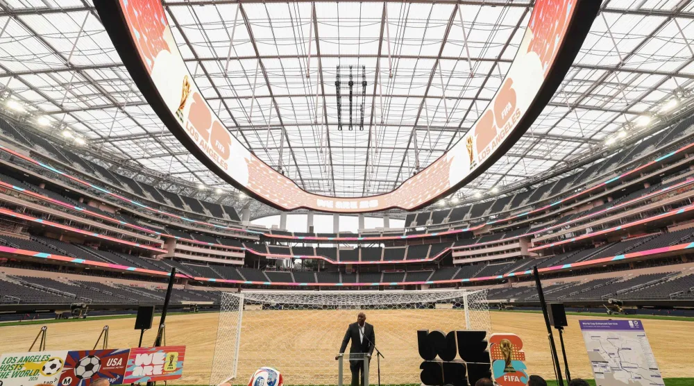 Earvin “Magic” Johnson, Los Angeles World Cup 2026 Community Ambassador, speaks during the 30 Days to FIFA World Cup 2026 media event at SoFI Stadium before the pitch installation and temporary renaming to Los Angeles Stadium in Inglewood, California on May 12, 2026. (Photo by Patrick T. Fallon / AFP)