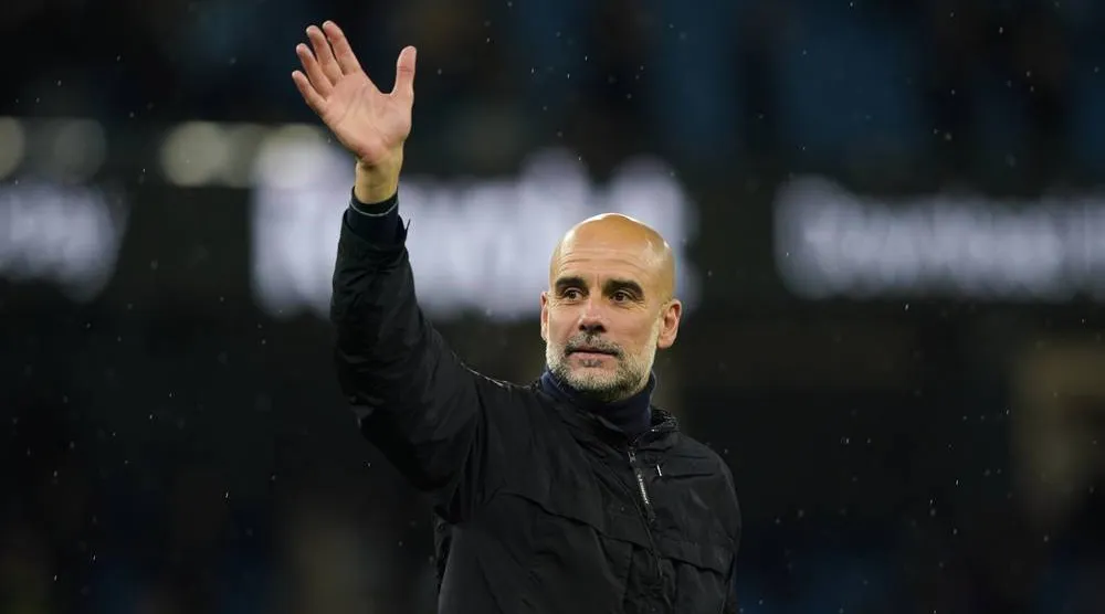  Manchester City's head coach Pep Guardiola greets fans at the end of the English Premier League soccer match between Manchester City and Crystal Palace in Manchester, England, Wednesday, May 13, 2026. (AP) 