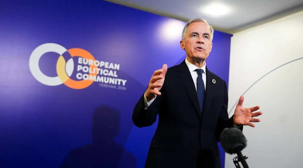 Canada Prime Minister Mark Carney talks to reporters during the 8th European Political Community Summit in Yerevan, Armenia on Monday, May 4, 2026. (Sean Kilpatrick/The Canadian Press via AP)