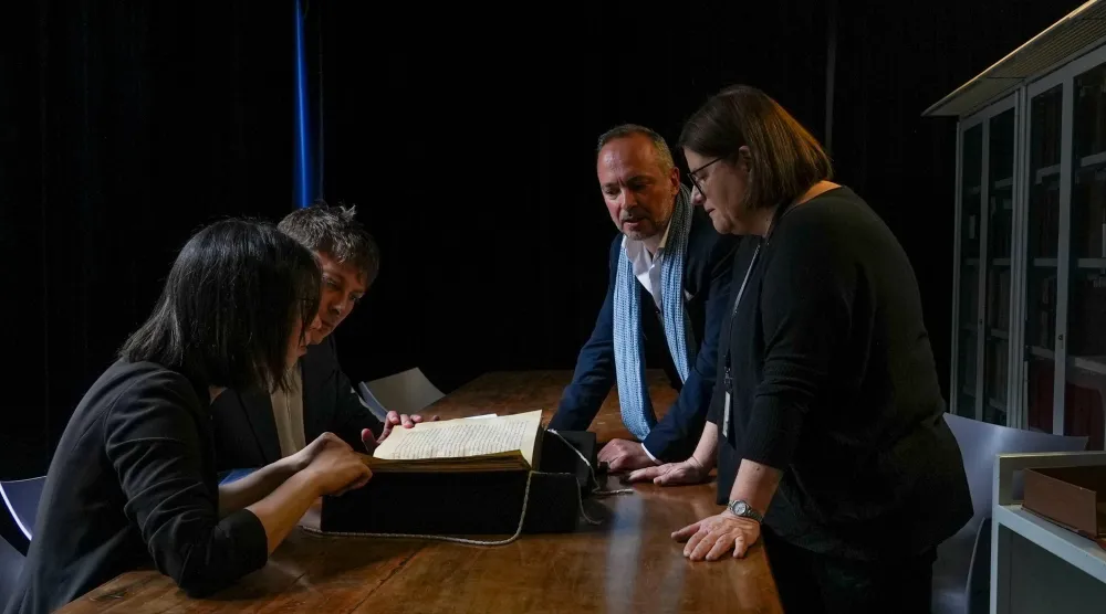 From left, Elisabetta Magnanti, Mark Faulkner of Dublin's Trinity College, Andrea Cappa and Valentina Longo of Rome's National Central Library examine a manuscript containing a rare, long-lost copy of Caedmon's Hymn — the first poem ever written down in Old English — at Rome's National Library, Thursday, May 8, 2026. (AP Photo/Andrea Rosa)
