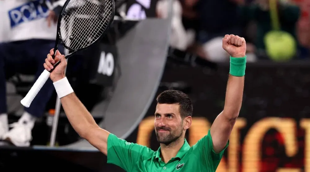 Serbia's Novak Djokovic celebrates victory over Spain’s Pedro Martinez during their men's singles match on day two of the Australian Open tennis tournament in Melbourne on January 19, 2026. (AFP)