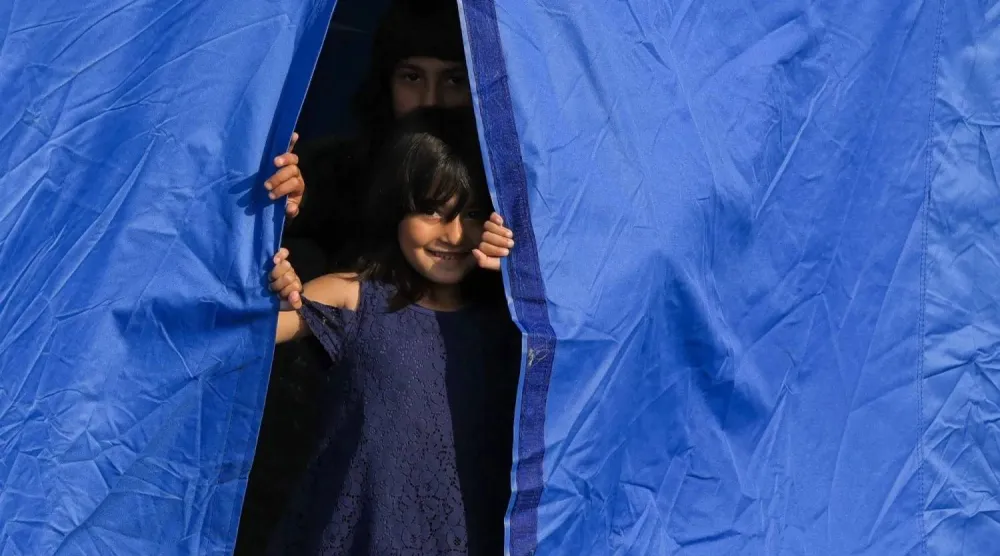 Children inside a tent at a camp for displaced people set up along Beirut’s seafront (Reuters) 