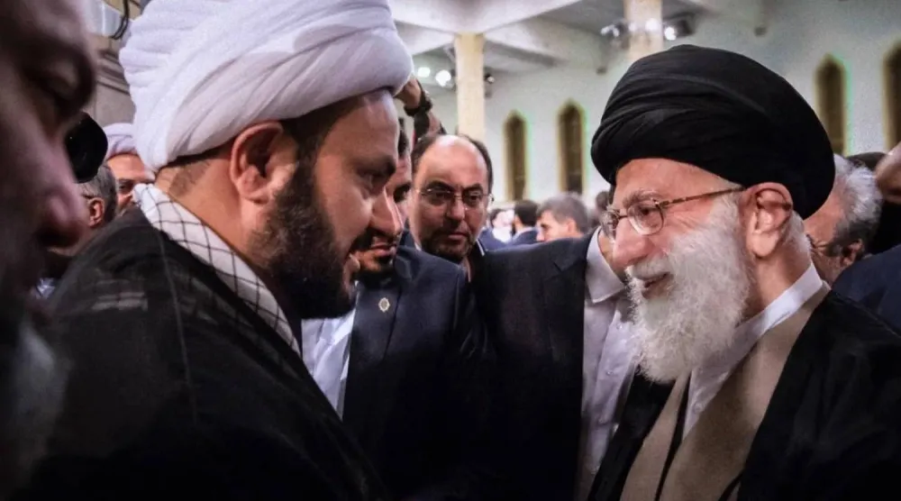 Slain Iranian Supreme Leader Ali Khamanei (R) and Nujaba Movement leader Akram al-Kaabi in Tehran in December 2018. (Supreme leader’s website) 