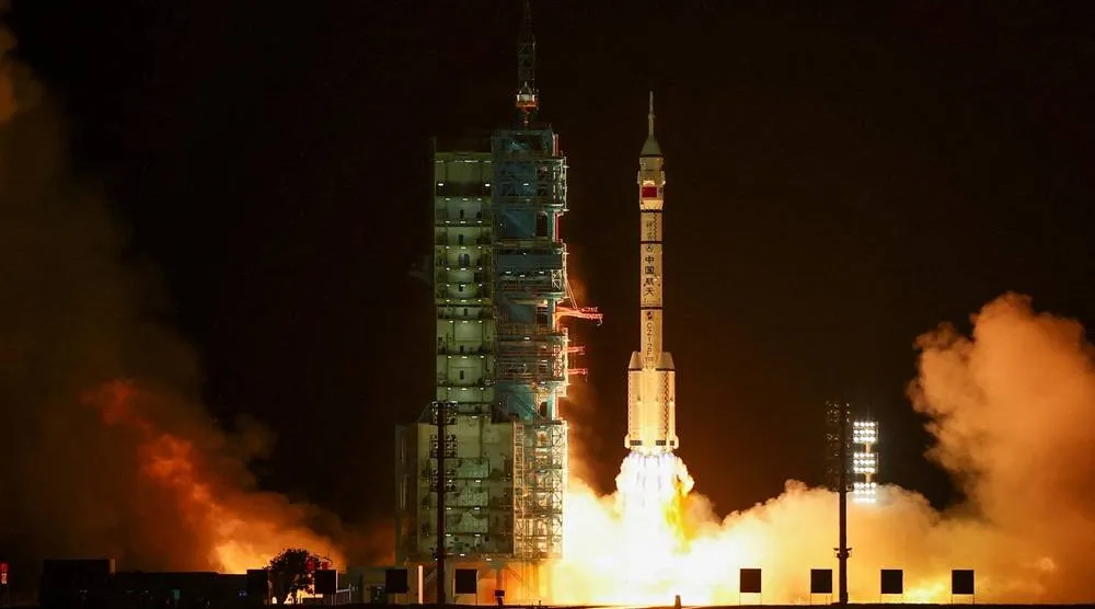 A Long March 2F rocket carrying the Shenzhou-23 spacecraft with astronauts Zhu Yangzhu, Zhang Zhiyuan, and Lai Ka-ying, who is the first astronaut from Hong Kong, blasts off to China's Tiangong space station from the launchpad at the Jiuquan Satellite Launch Center, near Jiuquan, Gansu province, China, May 24, 2026. (Reuters) 