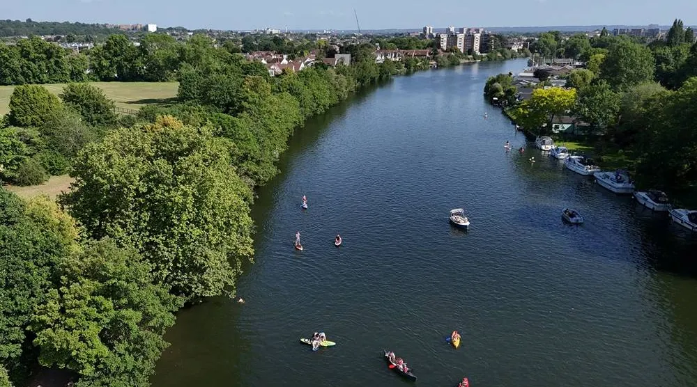 A drone view shows people using kayaks and paddle boards in the River Thames at Teddington Lock, London’s first official river bathing water site, as temperatures climb over the bank holiday weekend due to a heat dome spreading across the region, in London, Britain, May 24, 2026. (Reuters)