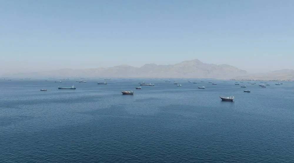  A drone view shows vessels sailing through the Strait of Hormuz, as seen from Musandam, Oman, May 25, 2026. (Reuters)