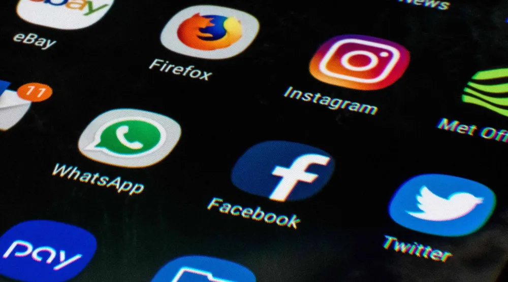 (FILES) This photo illustration shows a mobile phone screen displaying the icons for the social networking apps Facebook, Twitter and Instagram, taken in Manchester on March 22, 2018. (Photo by Oli SCARFF / AFP)