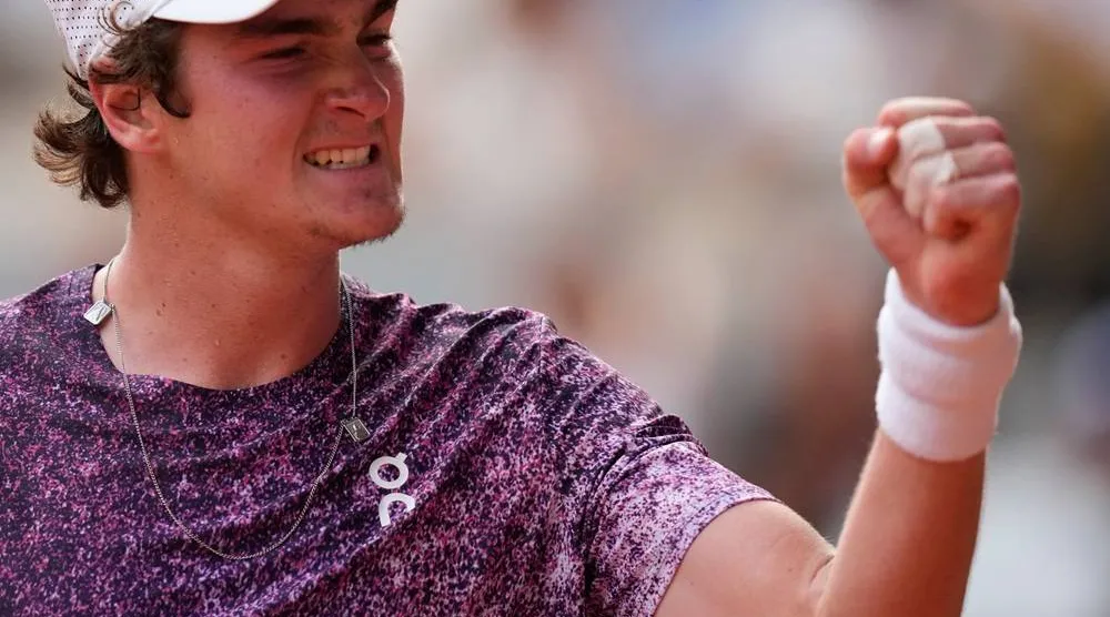 Joao Fonseca of Brazil reacts as he plays against Novak Djokovic of Serbia during their third round men's singles tennis match at the French Open tennis tournament in Paris, Friday, May 29, 2026. (AP) 