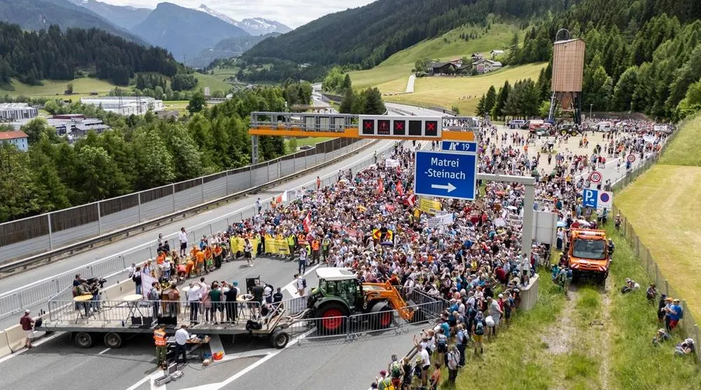 People demonstrate against transit traffic near the A13 Brenner Highway in the direction of Italy during the blockade of the Brenner Base Tunnel on May 30, 2026, on the Tyrolean Brenner Highway. (AFP)