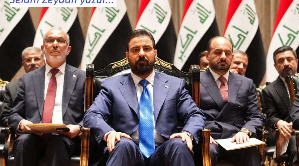  Başbakan adayı Ali el-Zeydi (ortada), Bağdat'ta kabinesini parlamentoya sunmadan önce, 14 Mayıs 2026 (AFP)