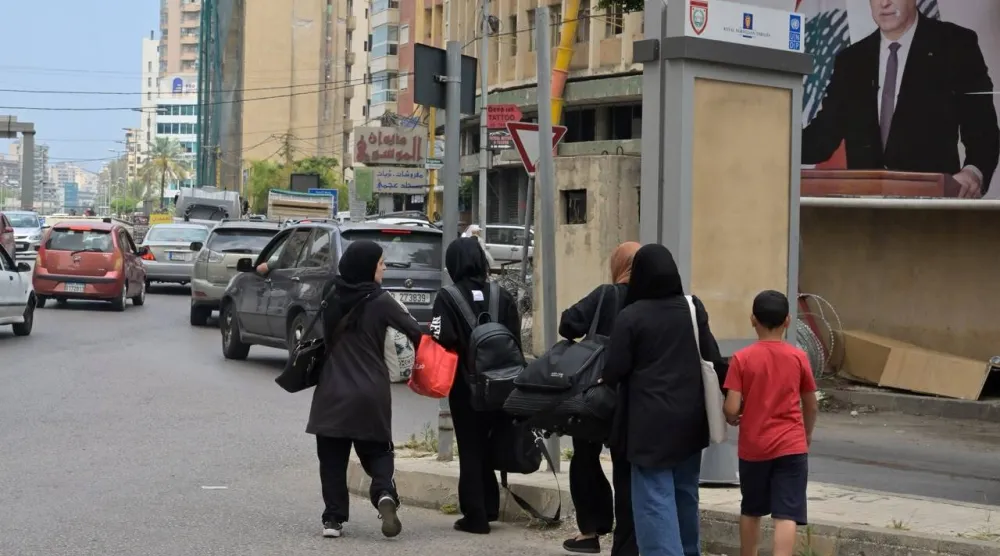 عائلات تغادر الضاحية الجنوبية بعد أن أمر نتنياهو بشنّ غارات على الضاحية في بيروت بلبنان (الشرق الأوسط)