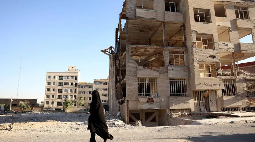  An Iranian woman walks past a residential building, destroyed by previous US-Israeli airstrikes, in Tehran, Iran, 02 June 2026. (EPA)