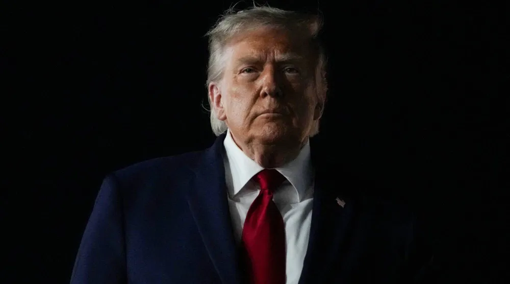 US President Donald Trump looks on, as he returns after attending Game 3 of the NBA Finals, at John F. Kennedy International Airport in New York, US, June 8, 2026. REUTERS/Nathan Howard