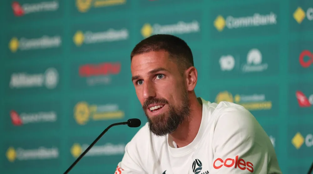 ALAMEDA, CALIFORNIA - JUNE 10: Milos Degenek #2 of Australia addresses the media after a training session ahead of FIFA World Cup 2026 at Oakland Roots & Soul Sports Club on June 10, 2026 in Alameda, California. Lachlan Cunningham/Getty Images/AFP 