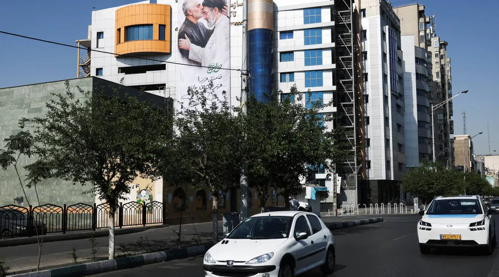 A banner with a picture of Iran's Supreme Leader, Mojtaba Khamenei and the late senior Iranian military commander, General Qassem Soleimani, on a building in Tehran, Iran, June 11, 2026. Majid Asgaripour/WANA (West Asia News Agency) via REUTERS