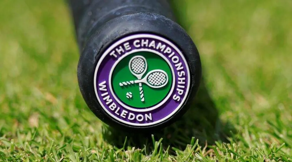 Tennis - Wimbledon - All England Lawn Tennis and Croquet Club, London, Britain - July 2, 2019 General view of the Wimbledon logo on the base of the handle of a tennis racquet REUTERS/Andrew Couldridge/File Photo