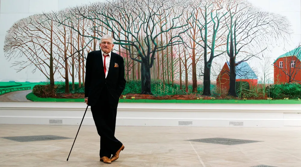British artist David Hockney poses as he unveils his painting "Bigger Trees Near Water", the largest painting ever shown at the Royal Academy's Summer Exhibition, London, Friday, May 25, 2007. (AP)