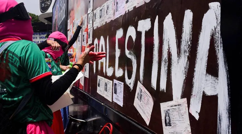 Demonstrators place missing person flyers on the trailer of a mounted police truck during a protest outside Azteca Stadium ahead of the opening match of the 2026 FIFA World Cup in Mexico City, Mexico, June 11, 2026. (Reuters)