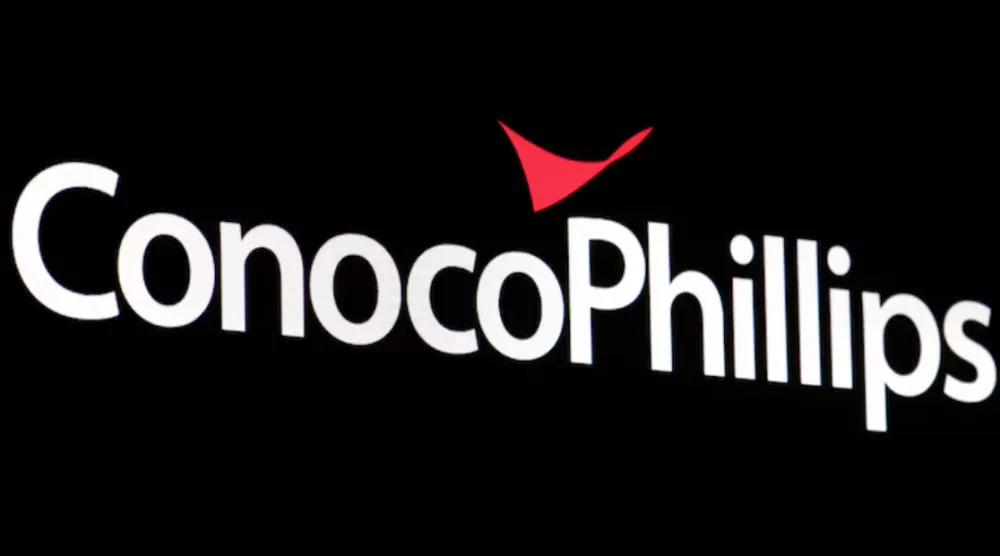 A screen displays the logo for ConocoPhillips on the floor of the New York Stock Exchange (NYSE) in New York City, US, April 6, 2022. REUTERS/Brendan McDermid