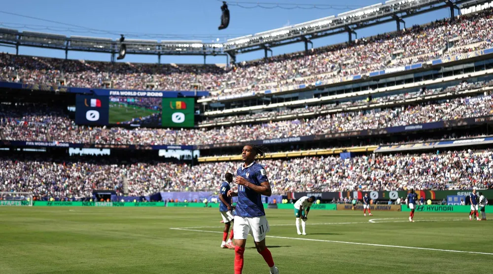 France's forward #11 Michael Olise prepares to take a corner during the 2026 World Cup Group I football match between France and Senegal at the New York/New Jersey Stadium in East Rutherford on June 16, 2026.  (Photo by CHARLY TRIBALLEAU / AFP)
