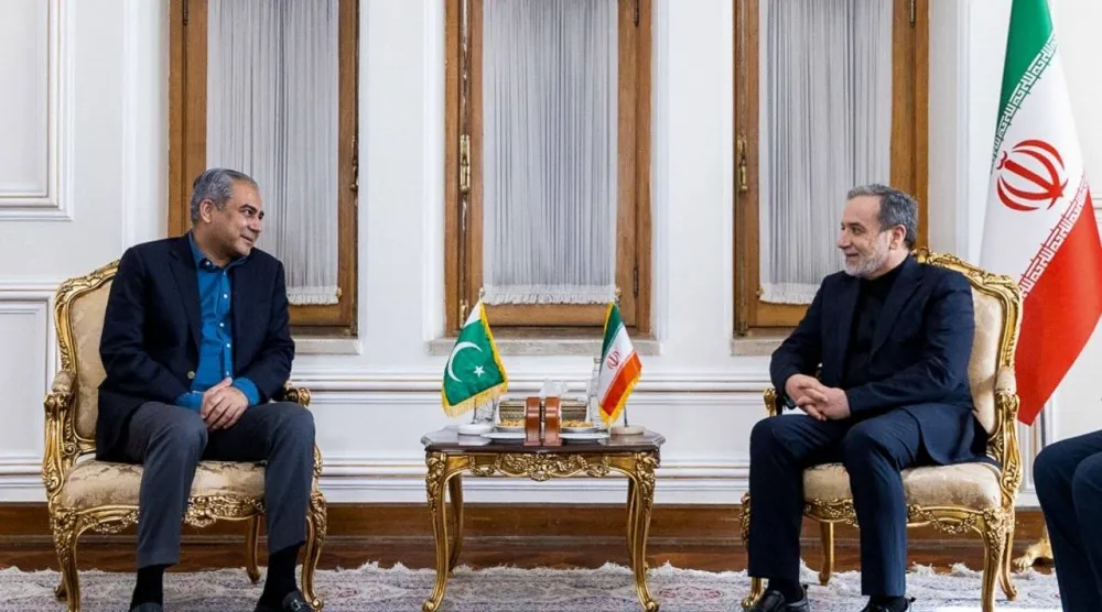 In this photo, released by the Iranian Foreign Ministry, Foreign Minister Abbas Araghchi, right, meets Pakistan's Interior Minister Mohsin Naqvi, in Tehran, Iran, Saturday, June 20, 2026. (Iran's Foreign Ministry, via AP)