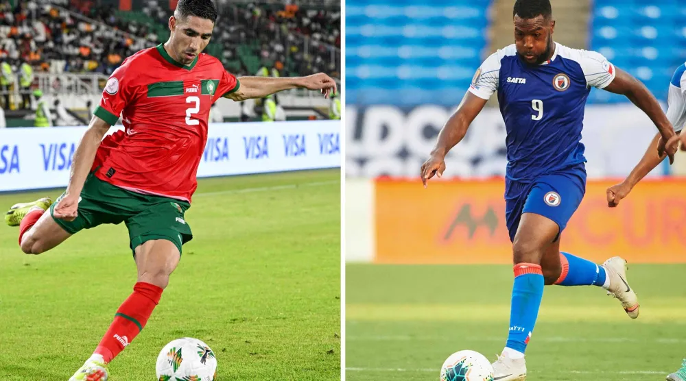 مدافع منتخب المغرب أشرف حكيمي (يسار) ومهاجم منتخب هايتي دوكنز نازون (أ.ف.ب)