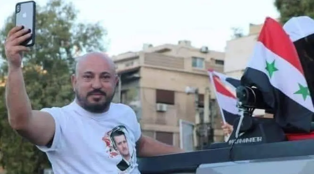 متداولة لوسيم الأسد متباهياً بسطوته فترة النظام البائد