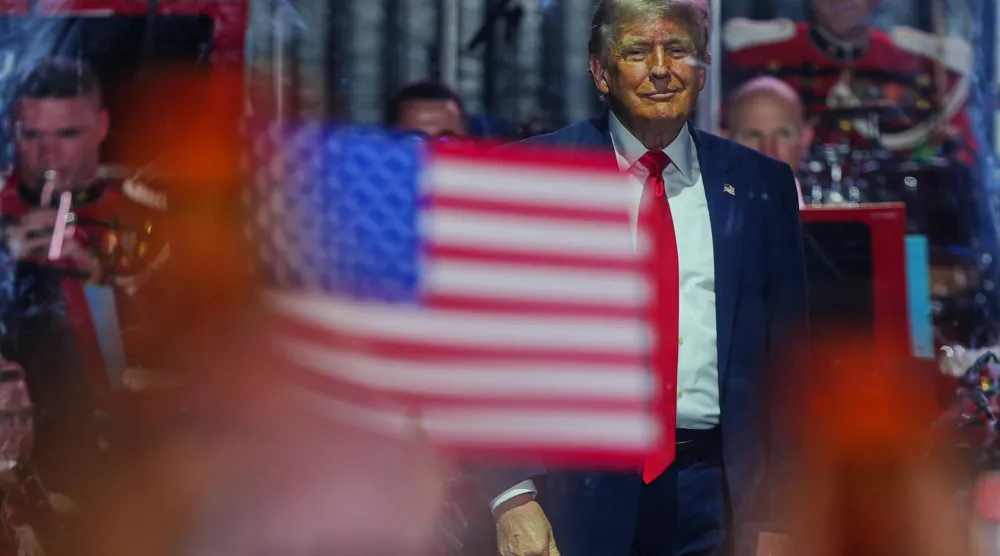 President Donald Trump stands on stage after speaking at the opening of the Great American State Fair on the National Mall, Wednesday, June 24, 2026, in Washington. (AP Photo/Julia Demaree Nikhinson)