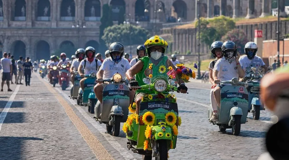  Vespa enthusiasts parade in front of the Colosseum during celebrations for the 80th anniversary of the Vespa scooter, in Rome, Saturday, June 27, 2026. (AP)