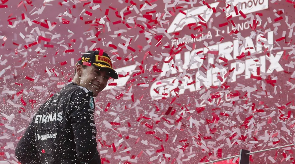 Formula One F1 - Austrian Grand Prix - Red Bull Ring, Spielberg, Austria - June 28, 2026 Mercedes' George Russell celebrates on the podium after winning the Austrian Grand Prix REUTERS/Lisa Leutner