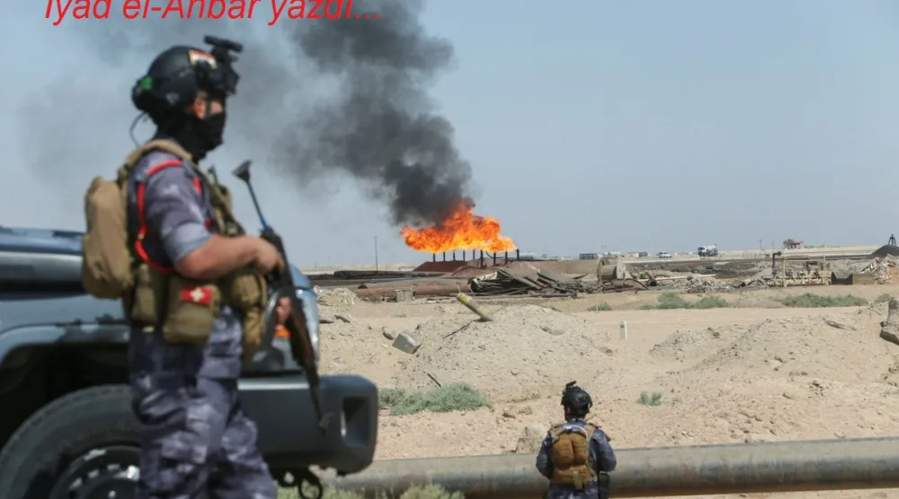 Irak'ın Basra kentindeki Rumeyle petrol sahasında, Irak Enerji Polisi'nin silahlı devriyesi sırasında görülen gaz alevleri, 8 Haziran 2026