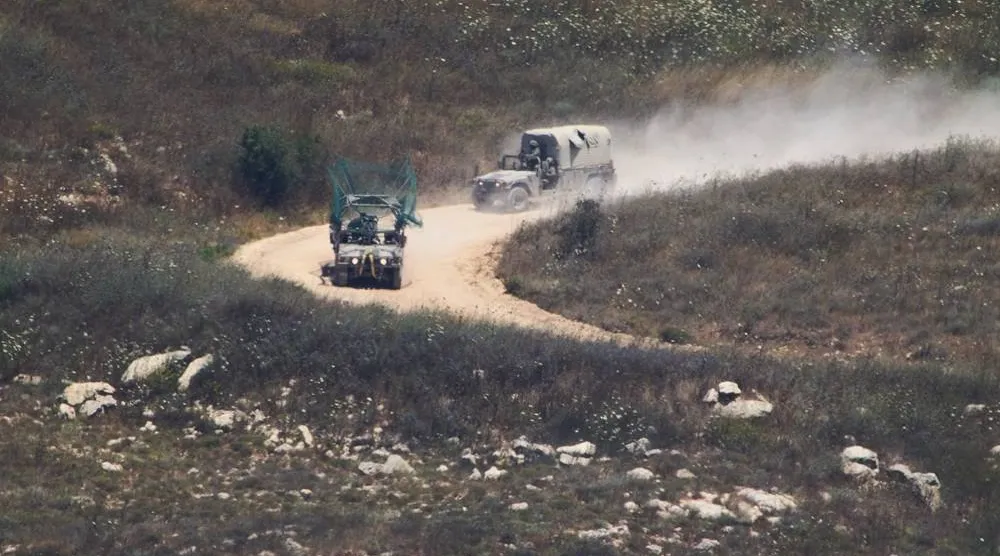  Israeli soldiers drive in southern Lebanon as seen from northern Israel, Wednesday, July 1, 2026. (AP) 