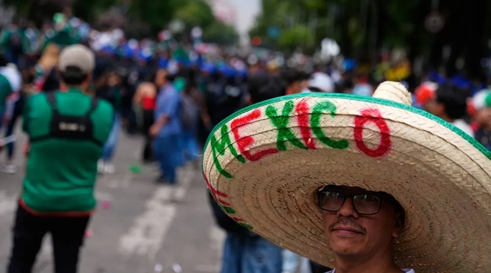  A football fan wearing a sombrero attends a watch party for the World Cup match between Mexico and Czechia on Reforma Ave., near the Angel of Independence monument in Mexico City, Wednesday, June 24, 2026. (AP) 