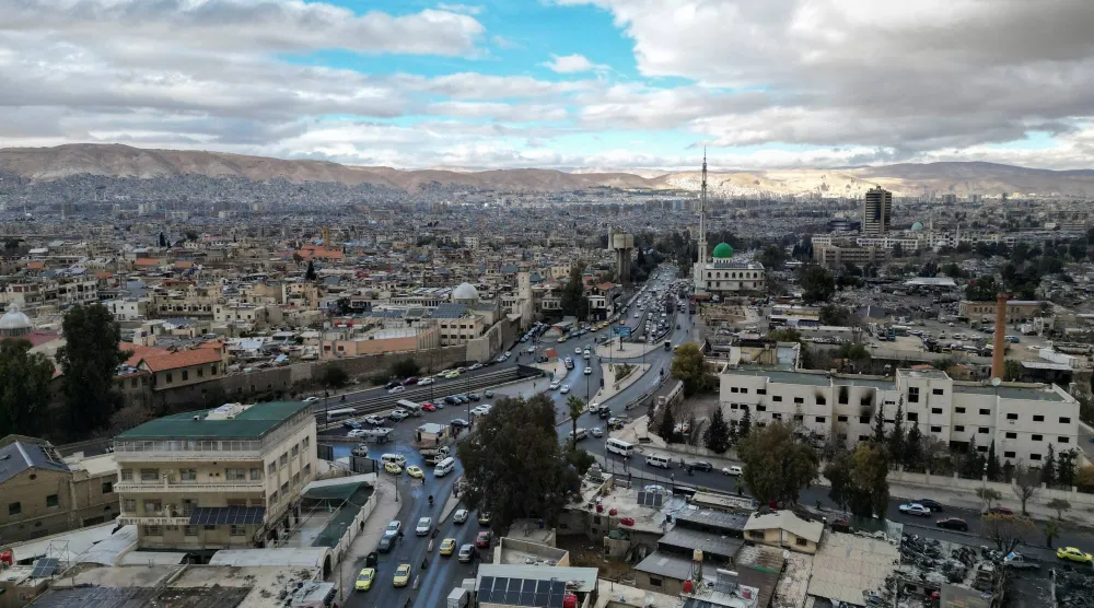 صورة التقطتها طائرة مسيّرة لمدينة دمشق في 22 ديسمبر 2024 (رويترز)
