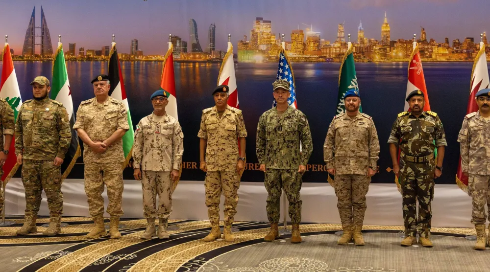 Participants pose for a family photo at the Bahrain conference. (CENTCOM)