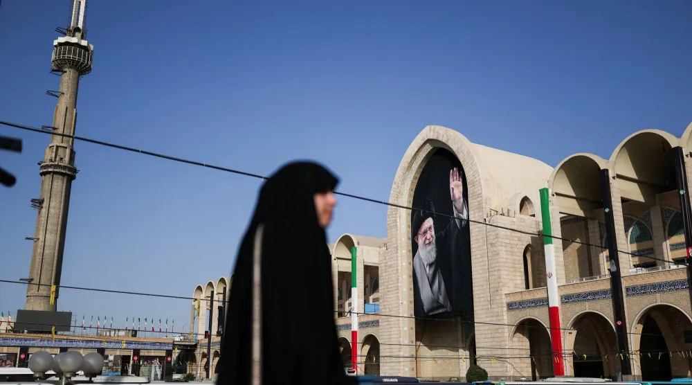 A woman walks at the Imam Khomeini Grand Mosalla on the day International delegates participate in a farewell ceremony for Iran's late Supreme Leader Ali Khamenei, who was killed on February 28 during Israeli and US airstrikes on Iran, in Tehran, Iran July 3, 2026. (Reuters)