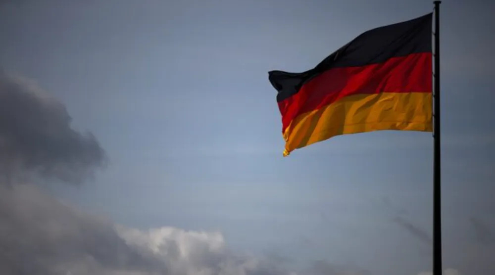 The German national flag flies in Berlin, Germany, April 5, 2022. REUTERS/Lisi Niesner 