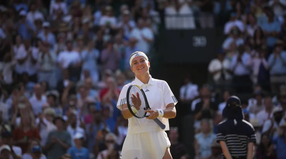 Karolina Muchova of Czech Republic celebrates her victory against Naomi Osaka of Japan in their quarter-final women's singles match at the Wimbledon Tennis Championships in London, Tuesday, July 7, 2026. (AP Photo/Kin Cheung)