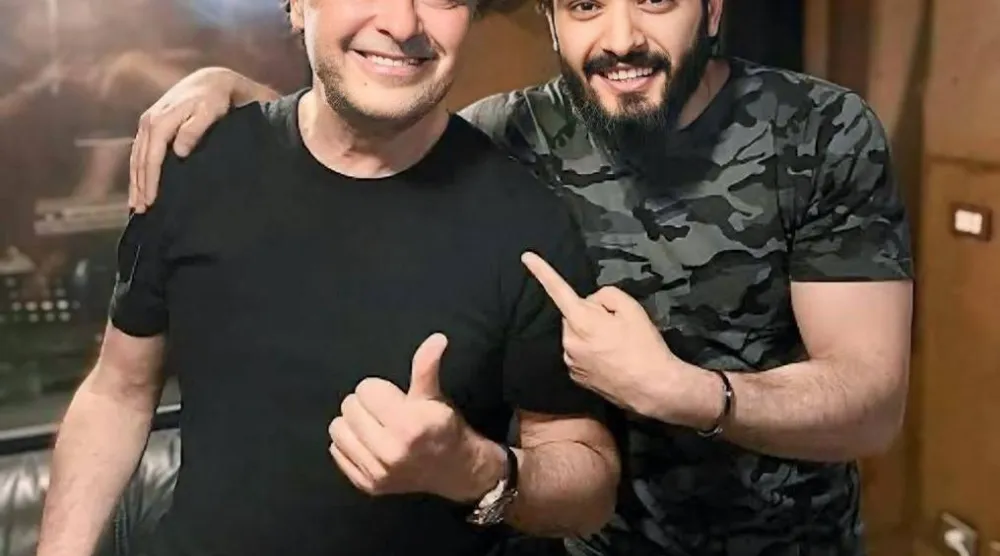 زعيم مع الفنان راغب علامة الذي تعاون معه بتلحين أغنية {التقيل تقيل} ({الشرق الأوسط})