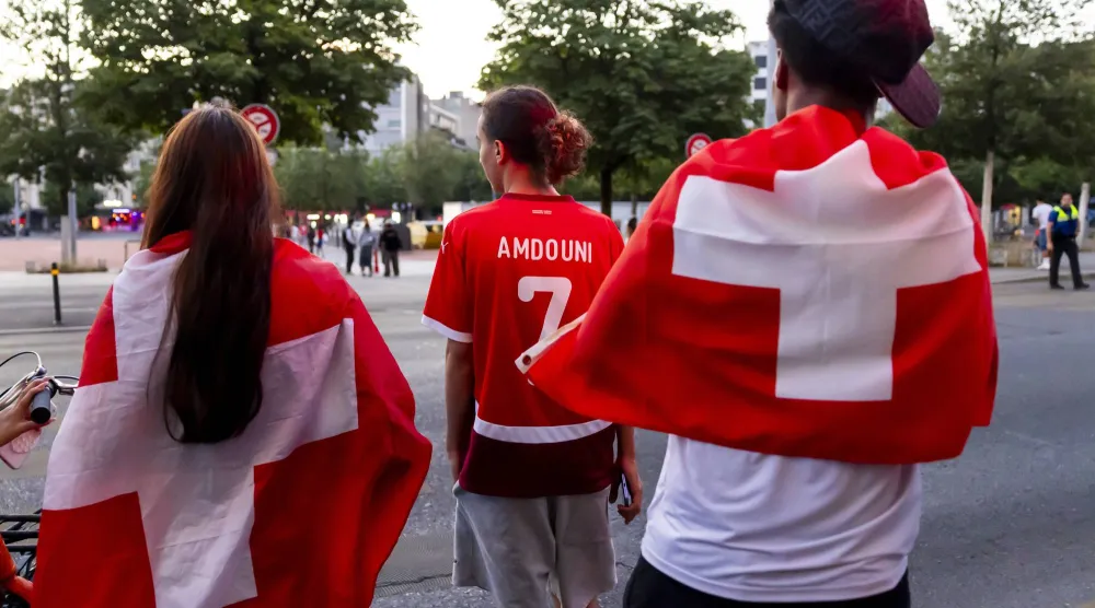 Swiss supporters react after Switzerland's defeat by Argentina in their 2026 FIFA World Cup quarter-final match in Geneva, Switzerland, 12 July 2026.  EPA/SALVATORE DI NOLFI