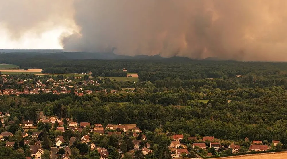  A drone view from Milly-la-Foret shows smoke rising from a wildfire in the Fontainebleau forest near Paris during a heatwave affecting large parts of France, July 13, 2026. (Reuters)
