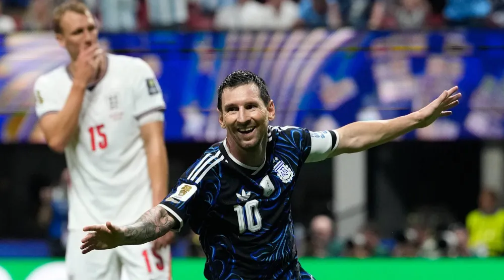 Argentina's Lionel Messi celebrates after teammate Enzo Fernandez scored their side's first goal during the World Cup semifinal soccer match between England and Argentina in Atlanta, Wednesday, July 15, 2026. (AP Photo/Rebecca Blackwell)